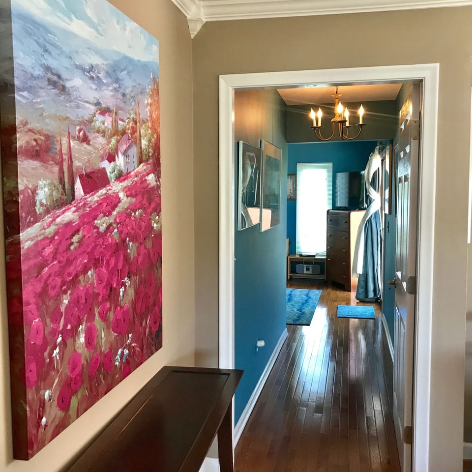 Hardwood floors lead to lakefront Maui King Bedroom.