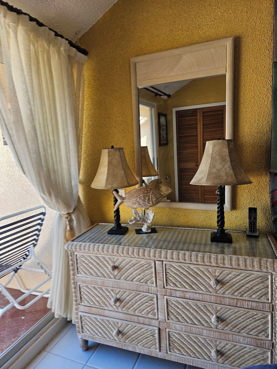 Upstairs bedroom with private patio to left.