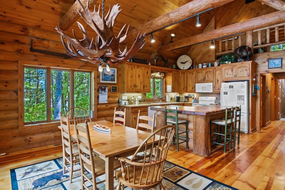 Real Moose Antler light, and a log center Island.  The center island is very big