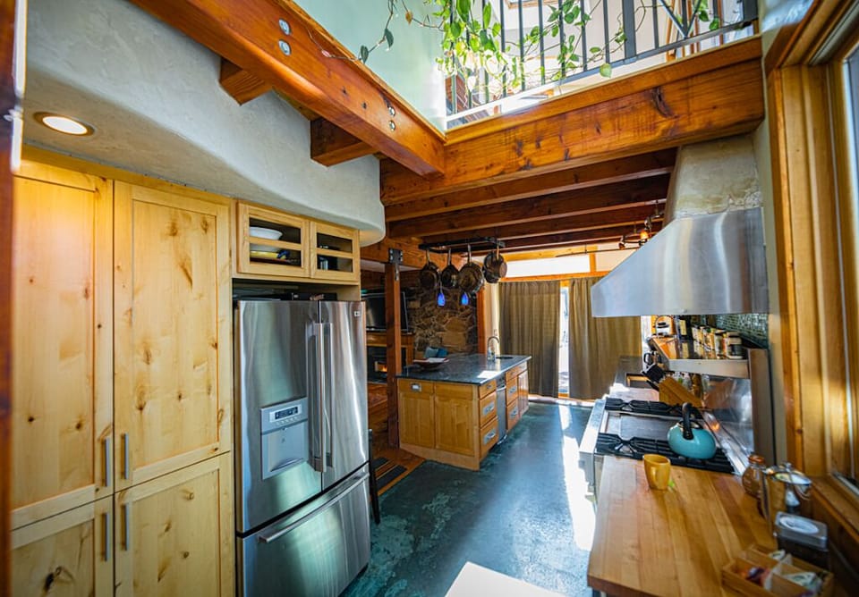 Kitchen with loft above. Refrigerator with on demand water and ice.