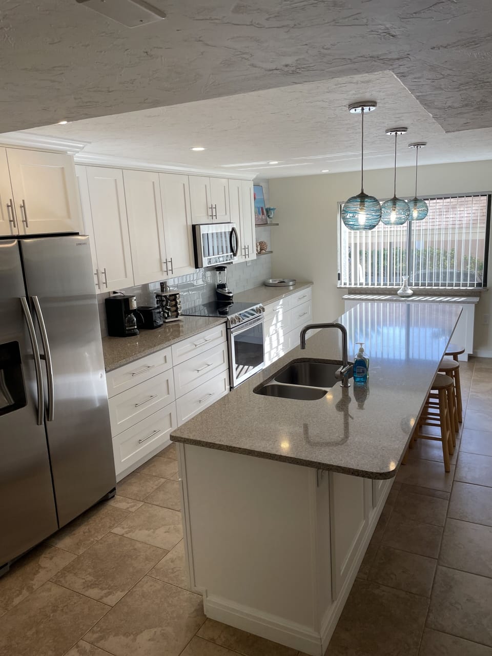 Large new kitchen with island seating.