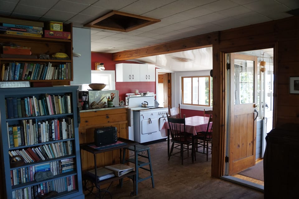 The living area connects to the kitchen/dining area.
