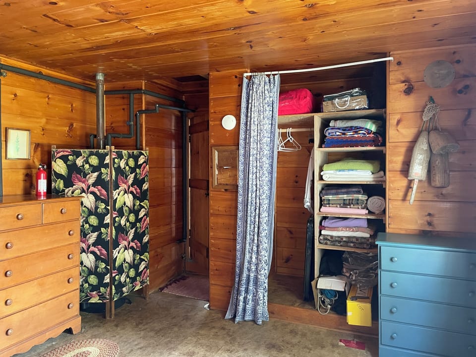 New in 2026: shelves in the closet for storing blankets. Water heater on left. 