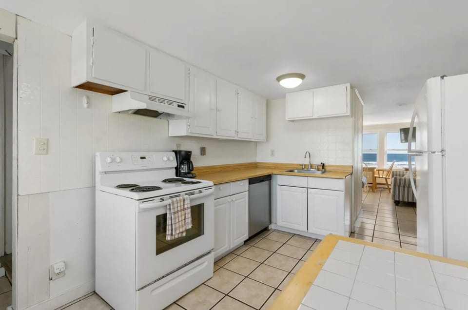Unit 2 front entrance brings you into the kitchen.
