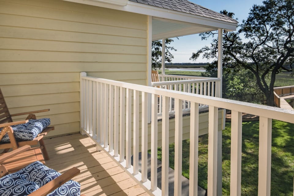 Master Bedroom private porch; main porch in background; both have marsh view