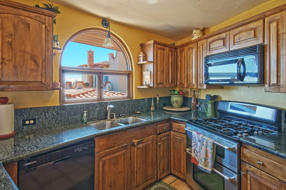 Kitchen, stove, microwave.