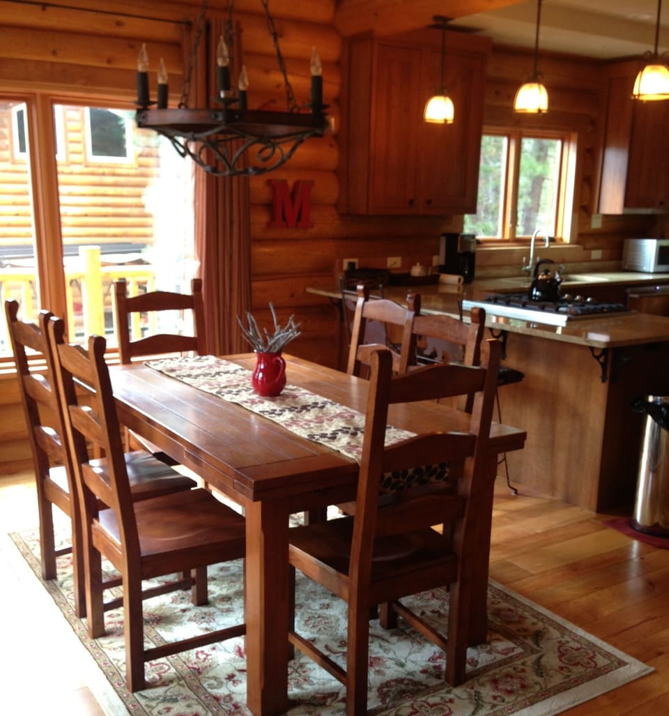 Dining area that opens up onto the back porch. The table extends to seat 8.