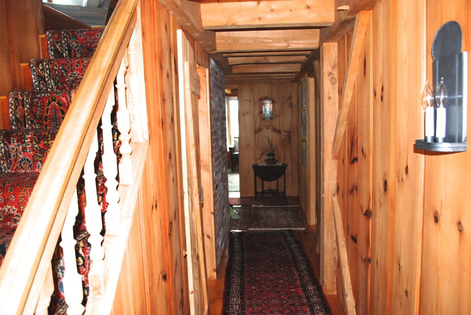 Note, hand carved railing & detailed custom craftsmanship along first floor hall