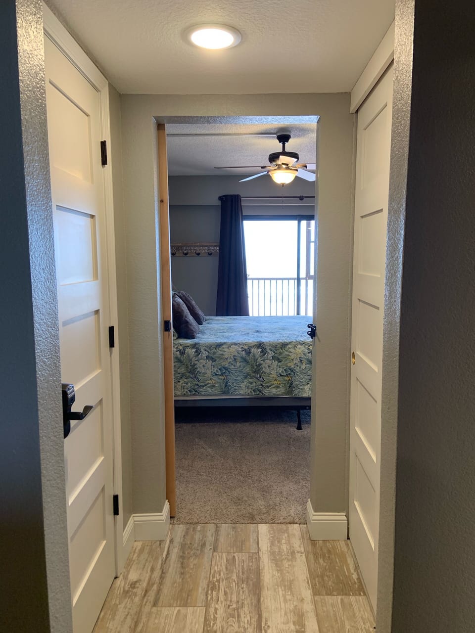 Looking into the master bedroom from bathroom
