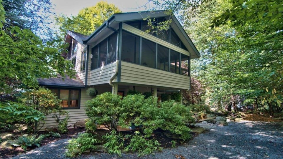 Front of the house, showing Screened porch and covered deck