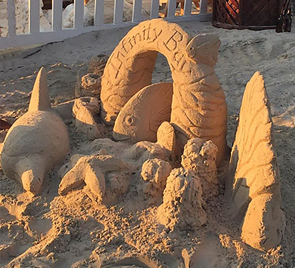 What will the resort artist create in the sand today?