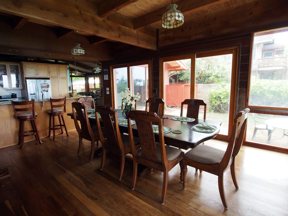 Dinning room with large windows look at a breath taking view of the ocean.