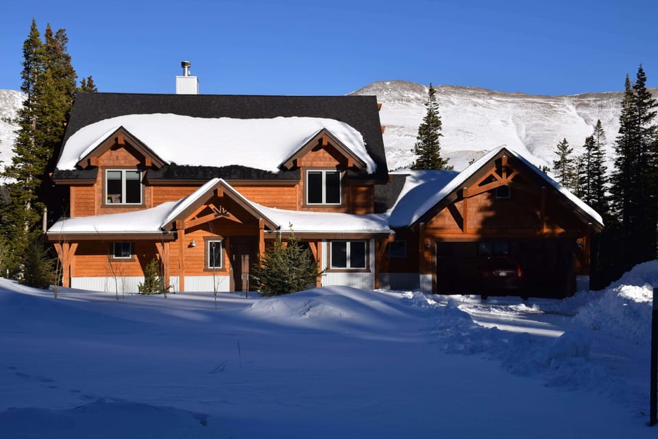 Front view of the house in the winter -- roads and driveway plowed regularly