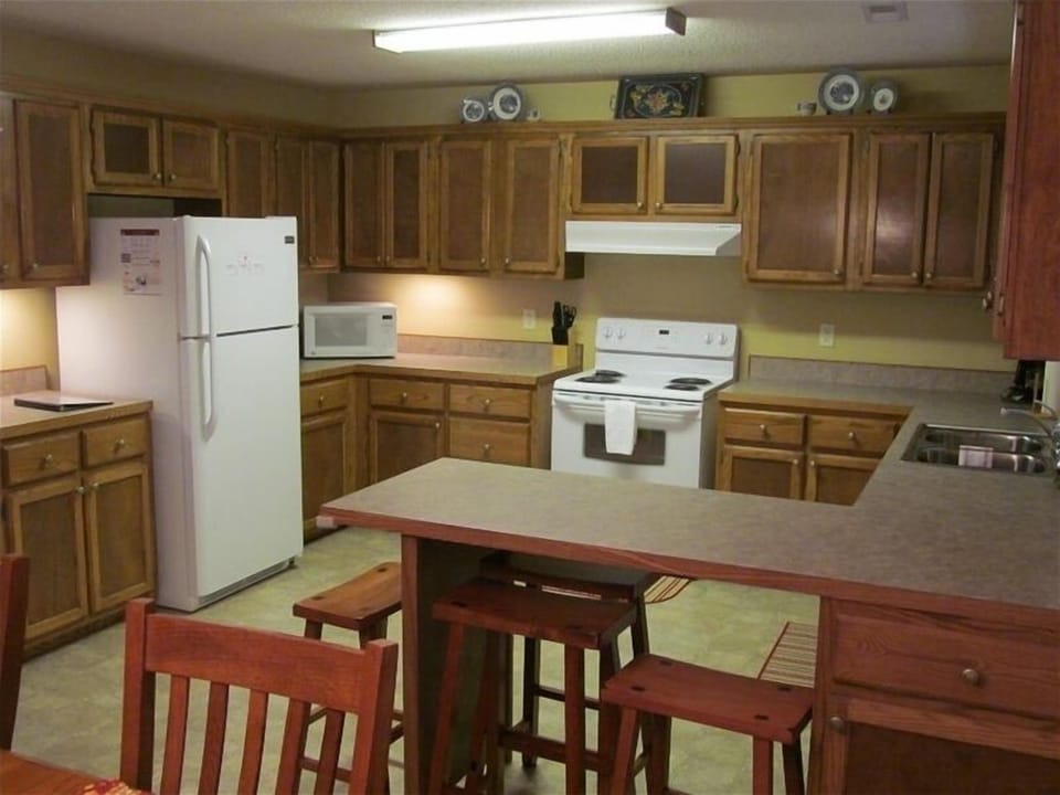 Upstairs kitchen is fully equipped with extra seating at the bar