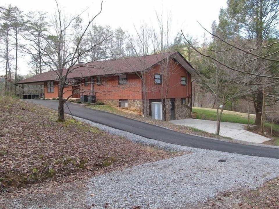 Partially paved private circle drive provides plenty of parking space