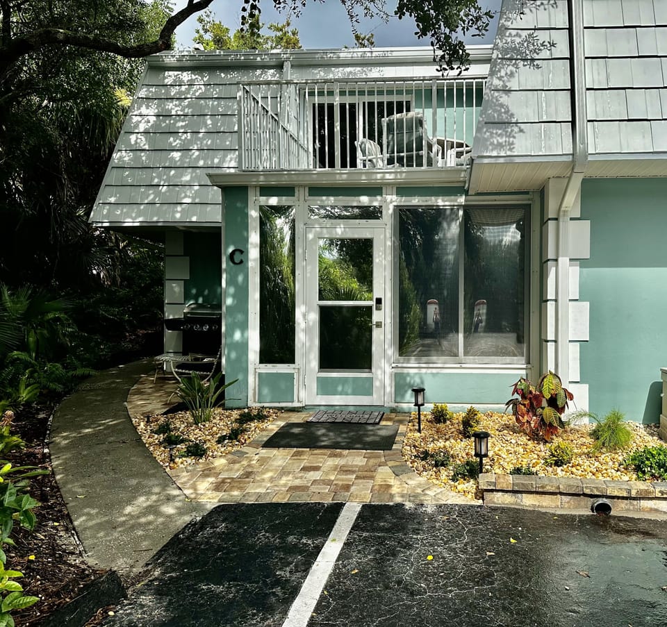 Peaceful setting with canopy of native Florida trees and a short walk to beach.