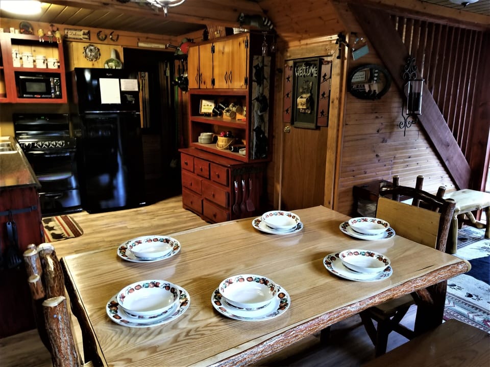 Large log dining table with benches & chairs provide seating for everyone 
