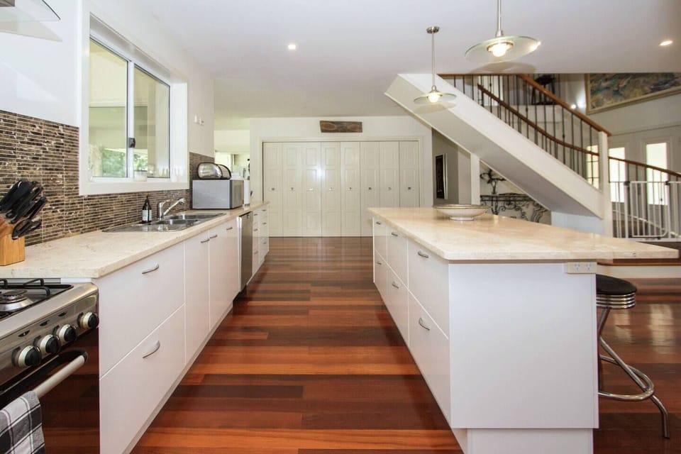 The kitchen is fully equipped to cook up a storm and includes a breakfast bar island.