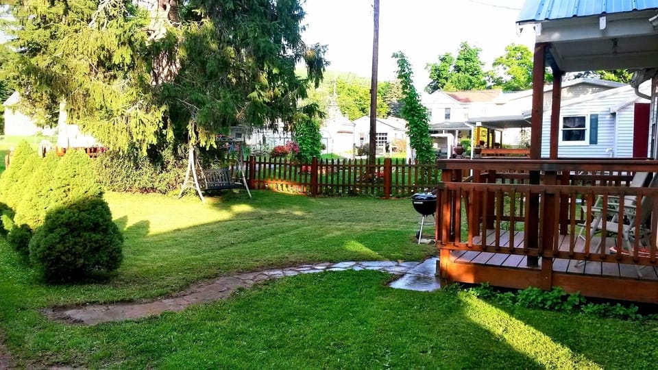 Area, front yard, garden swing, we are NOT in the woods. There are homes ne