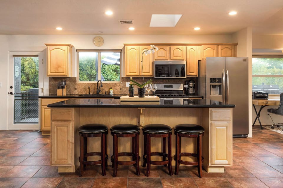 Modern meets classic in this fully-equipped kitchen, perfect for crafting culinary delights.