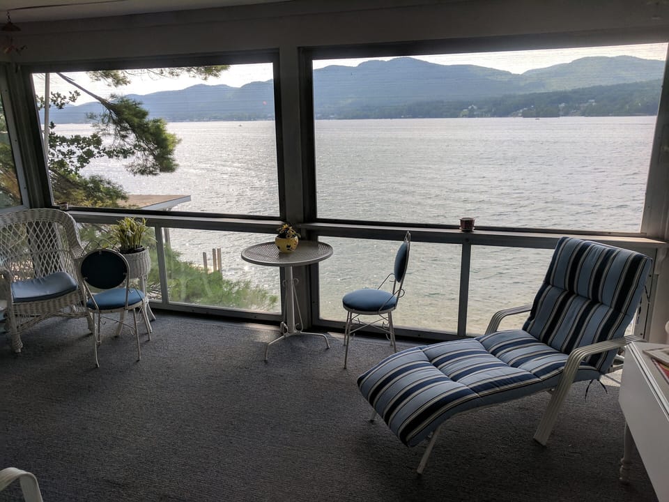 Main house screened porch with amazing views and can host full house for a meal!