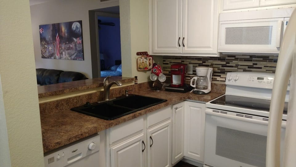 Kitchen. Stove and microwave, dishwasher.