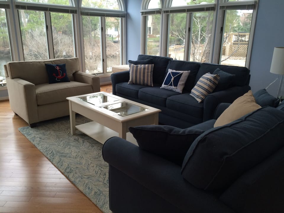Living Room with all windows on 2 sides for water view of the lake