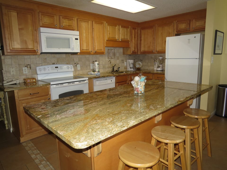 Large granite island with 4 barstools