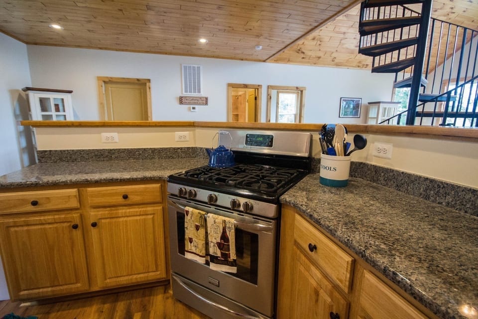 Full kitchen with stainless appliances and all the cookware you need