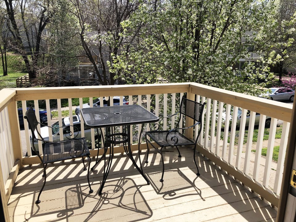 Enjoy coffee and a street view on the master bedroom balcony.
