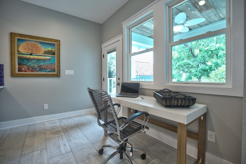 Work space is placed with a view of the lovely back yard.