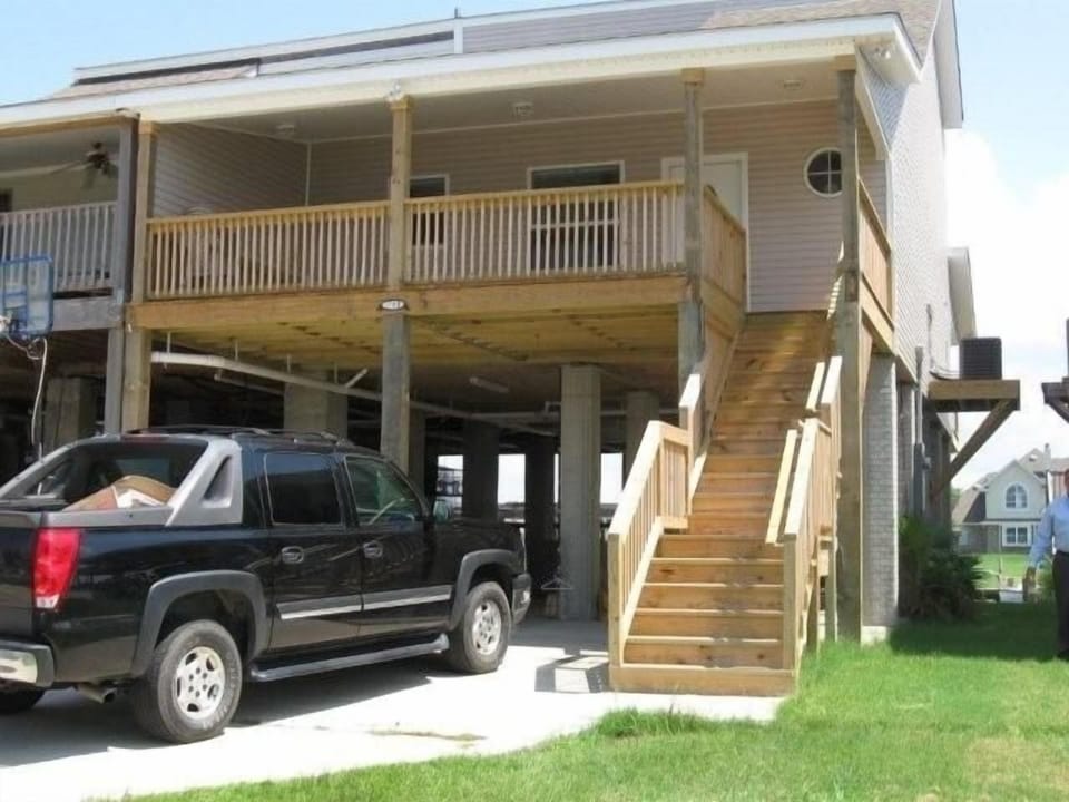 Front of house...barbecue area underneath house.