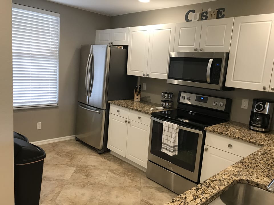 Full sized kitchen, fully stocked with brand new stainless steel appliances.