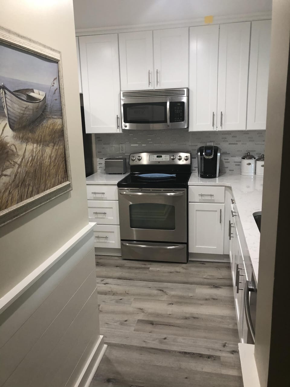 Stainless appliances, new cabinets to the ceiling. 
