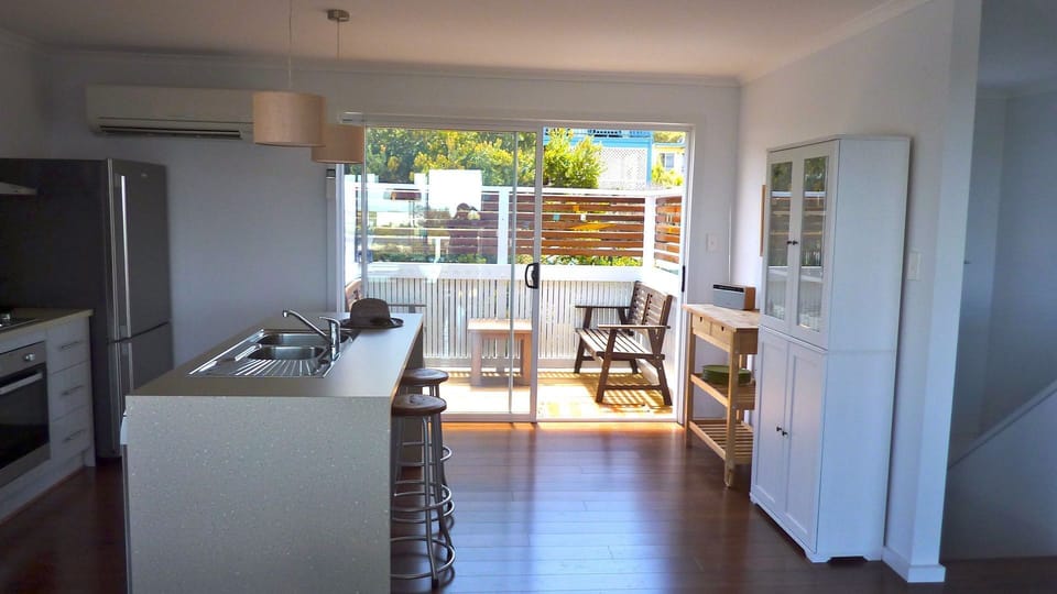 Kitchen through to sunny back deck in mornings
