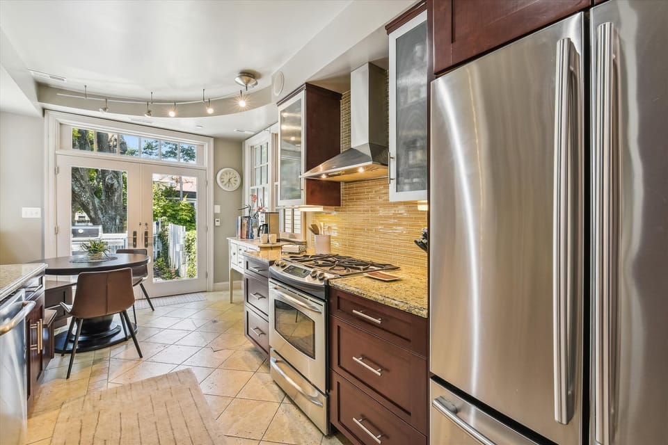 Granite counters, stainless appliances and heated tile floors
