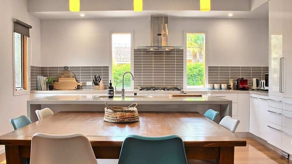Huge kitchen island overlooking two dining areas.