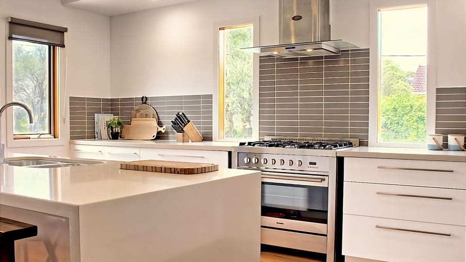 Open plan living space with large fully-equipped open kitchen with lots of natural light.