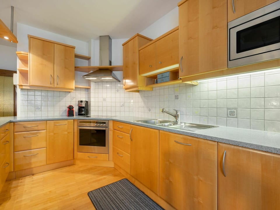 Countertop, Cabinetry, Furniture, Kitchen, Room, Property, Interior Design, Kitchen Stove, Yellow, Building