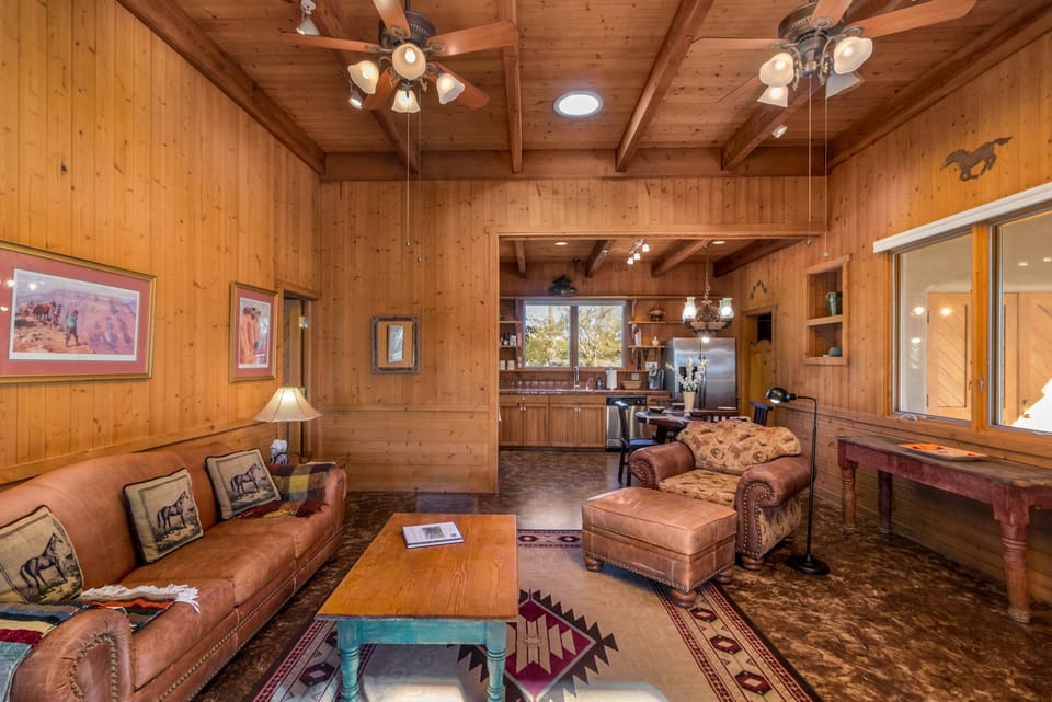 Step into the cabin's living area from the entrance and feel the warmth of a welcoming retreat. Comfort and relaxation await. 🛋️🚪🏡 #HomeSweetCabin