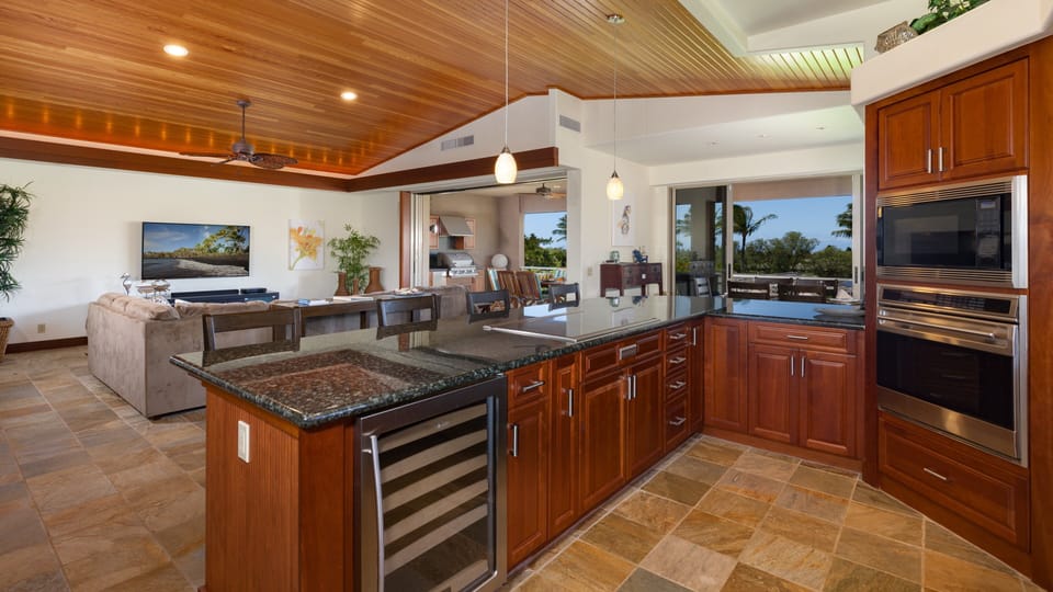 Gourmet Kitchen equipped with wine fridge, assortment of spices oil and many other essentials