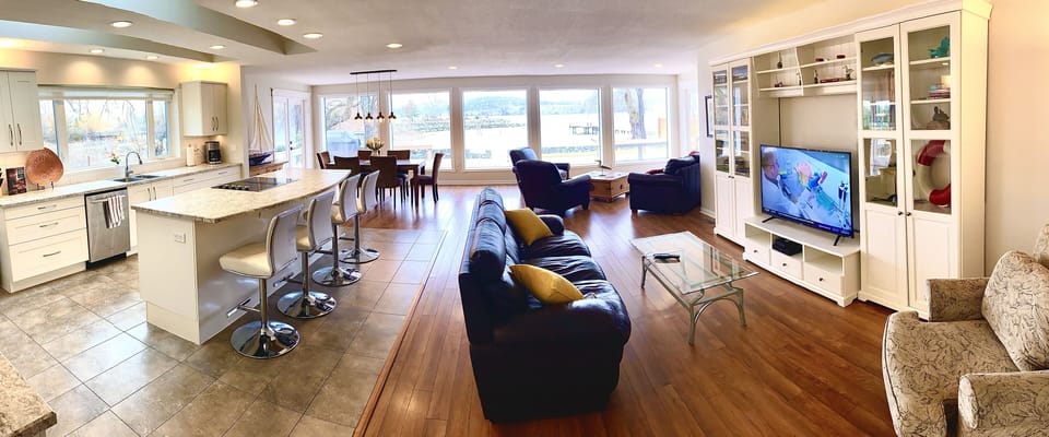 The great room is expansive with an awesome view of Lake Okanagan.