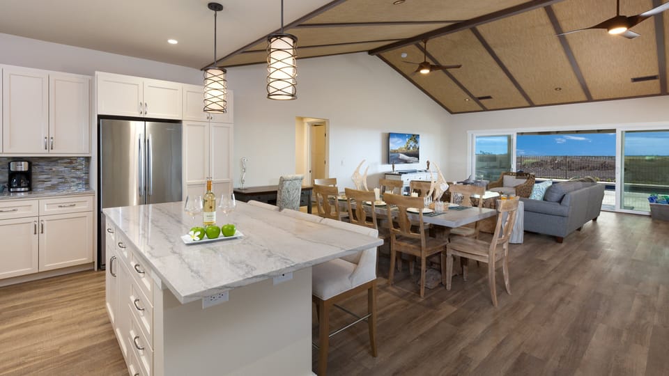 Large dining table that seats eight, additional island seating for three