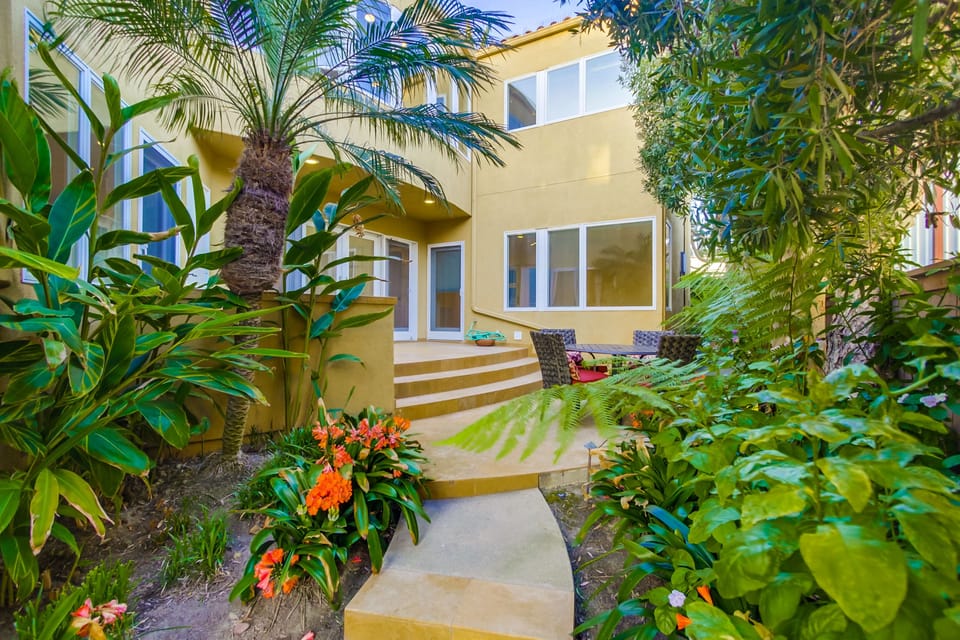 Tropical landscaping throughout.