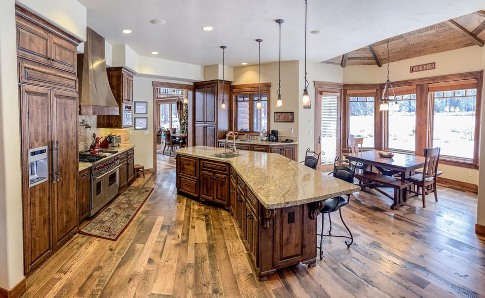 Fully stocked gourmet kitchen,wolf stove ,nook looking out to yard /golf course