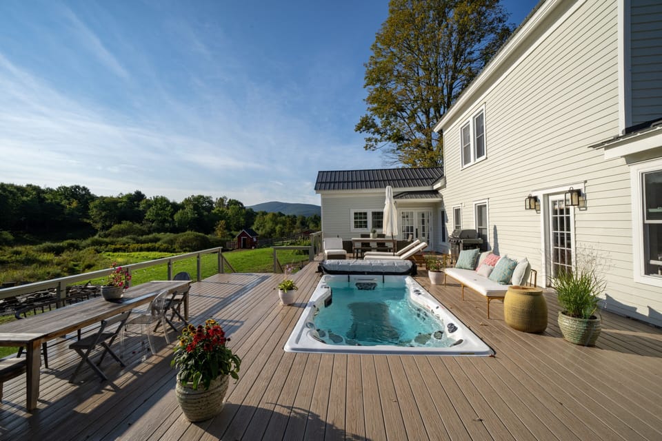 Deck with swim spa. We keep it at 80 Fahrenheit for you to enjoy year-round.