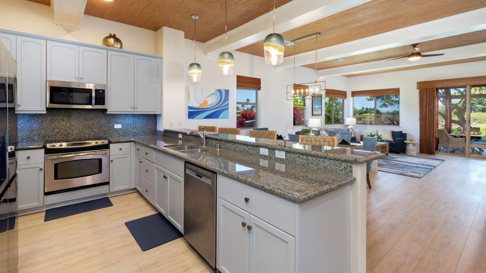 Well-equipped kitchen with cookware, spices and oils