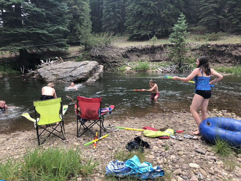 Swim hole and zip line by cabin. River is approx 6ft deep by big rock