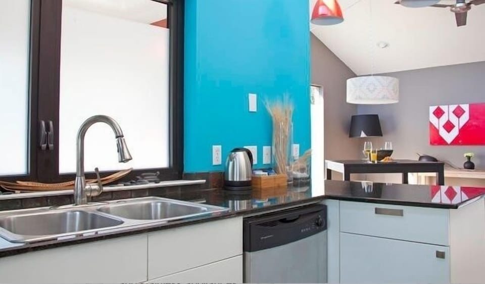 Kitchen area is stocked with coffee, tea and basic condiments.
