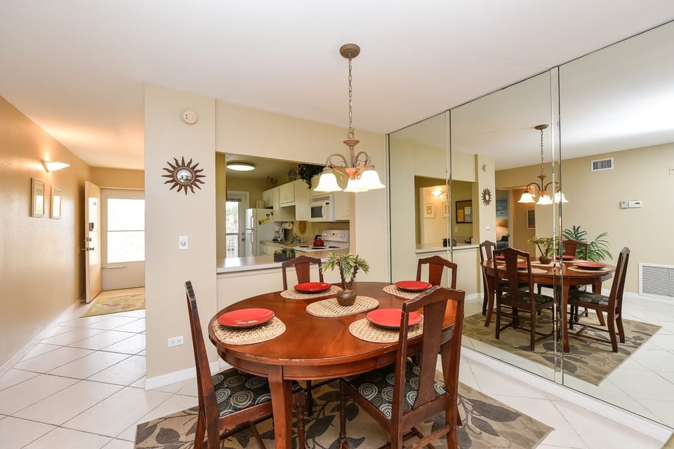 Dining area facing kitchen and front door.